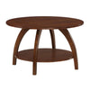 Arlo round solid wood coffee table in brown with four arched legs and a lower shelf, on a white background