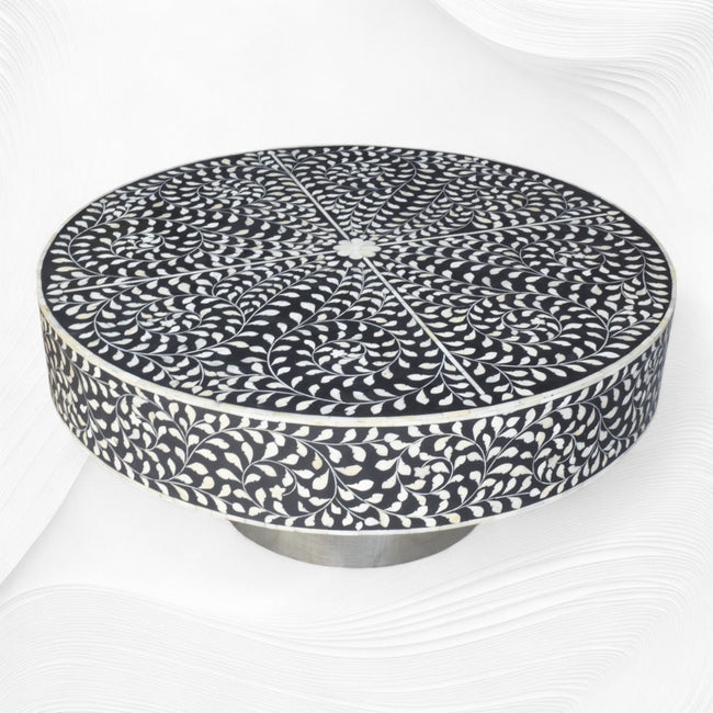 Mesa de centro con incrustaciones de hueso negro y base plateada