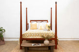 Cottage Lattice Four Poster Solid Wood Bed with bedding and a wooden bench