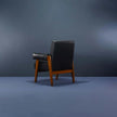Counsel Bolster Arm Wooden Armchair angled view