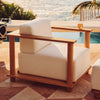 Cylinder Arm Solid Teak Lounge Chair in a warm setting