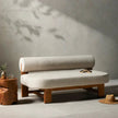 Drum Bolster Arm Wooden Sofa in a room