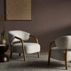 Dune Bentwood Arm Boucle Lounge Chair pair in a room