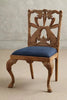 Hare Hand Carved Wooden Dining Chair with a blue upholstered seat