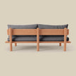 Isle Armless Upholstered Teak Sofa from behind
