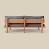 Isle Armless Upholstered Teak Sofa from behind