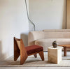 Kora Cane Back Wooden Lounge Chair in a living room
