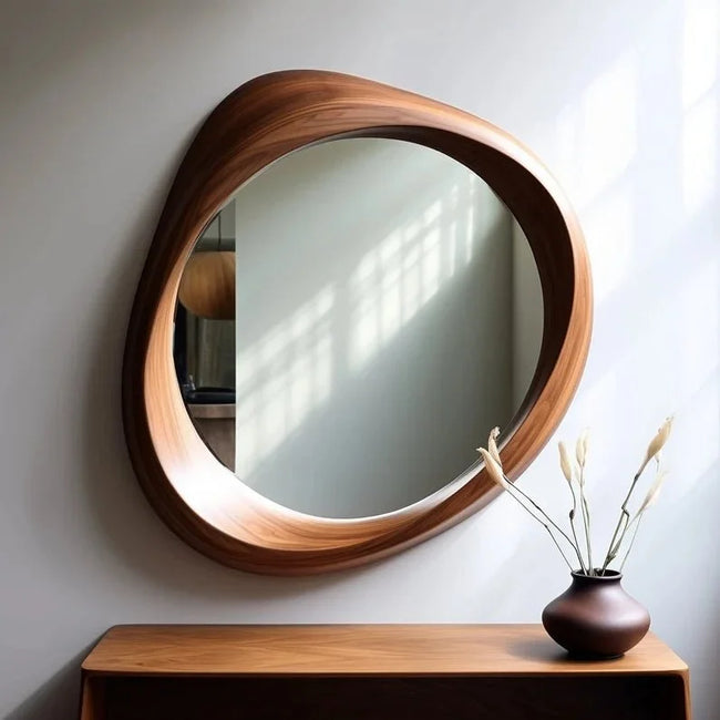 Mira Asymmetrical Wooden Wall Mirror above a wooden console with a vase