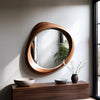 Mira Asymmetrical Wooden Wall Mirror hung over a low wooden console