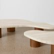 Close-up of the Nova coffee table tops and cylindrical brown legs