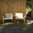Pelago Teak Wood Lounge Chair pair on a deck