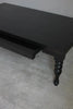 Rhea black coffee table with its hidden drawer pulled open