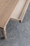 Top view of the natural wood Rhea coffee table showing the hidden drawer