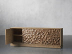 Ripple Carved Four Door Media Console with a door open