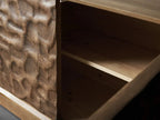 Ripple Carved Four Door Media Console close-up of the carved texture and shelf