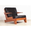 Serra Slatted Wood Lounge Armchair with black cushions