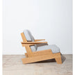 Serra Slatted Wood Lounge Armchair light cushions angled