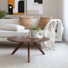 Sora splayed leg coffee table in a bright living room with a white sofa