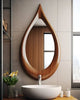 Teardrop Solid Wood Wall Mirror above a white bathroom basin
