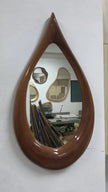 Teardrop Solid Wood Wall Mirror on a light wall