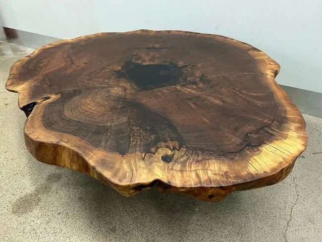 Terra natural solid wood slab coffee table seen from above, showing the live edge and grain