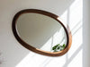 Wave Oval Walnut Wood Wall Mirror close view of the curved walnut frame