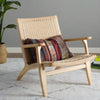Weave Rope Seat Wooden Lounge Chair with a patterned cushion
