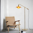 Weave Rope Seat Wooden Lounge Chair beside a floor lamp