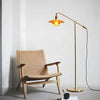 Weave Rope Seat Wooden Lounge Chair beside a floor lamp